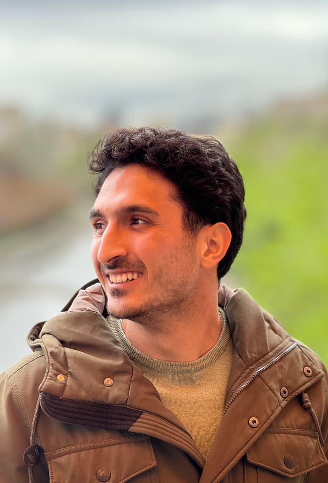 a portrait of Reza Attar